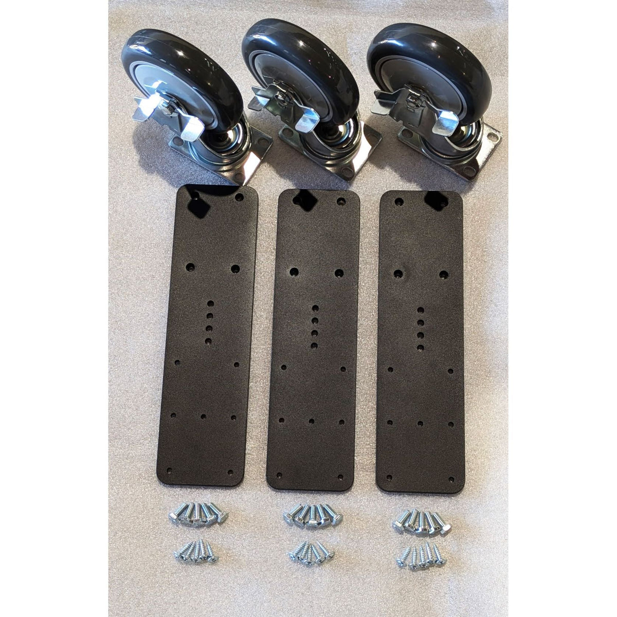 JMI Ez-Glide Wheeley Kit parts as supplied: three steel mounting plates, three 5 inch Total Lock casters and fasteners for adding wheels to a Dobsonian ground board