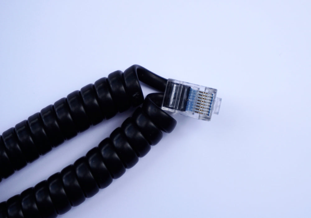 Coiled encoder cable plug close-up